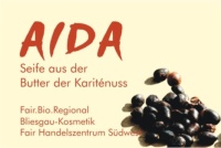 3 Frauen beim Karitebutter schlagen